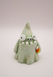 Halloween folk art monster zombie like ghost with candy corn