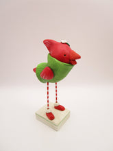 Christmas cardinal bird wearing sweater