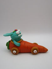 Easter folk art bunny monster riding a carrot car