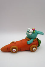 Easter folk art bunny monster riding a carrot car