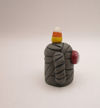 Halloween folk art small mummy man a candy corn on its head