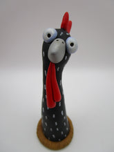 Spring folk art chicken sitting on nest