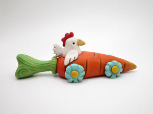 Easter Spring folk art chicken riding in carrot car