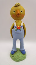 Easter or Spring folk art chick wearing light blue overalls