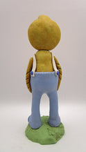 Easter or Spring folk art chick wearing light blue overalls