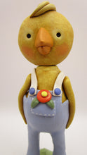 Easter or Spring folk art chick wearing light blue overalls
