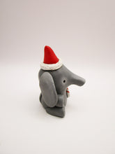 Christmas folk art small elephant with Santa hat