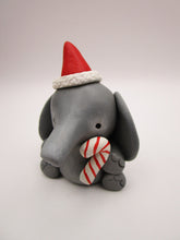 Christmas folk art small elephant with Santa hat