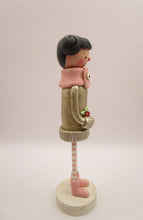 Christmas folk art girl in champagne shimmer sweater with wood legs