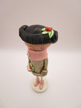 Christmas folk art girl in champagne shimmer sweater with wood legs