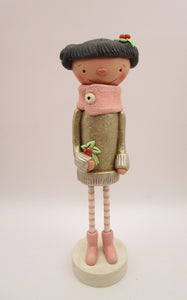 Christmas folk art girl in champagne shimmer sweater with wood legs
