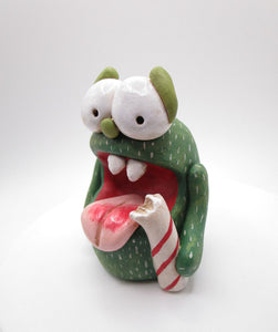 Christmas candy cane monster with bell trimmed hat