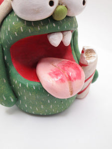 Christmas candy cane monster with bell trimmed hat