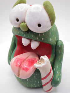 Christmas candy cane monster with bell trimmed hat