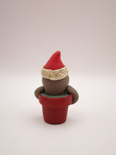 Christmas small sloth in pot wearing Santa hat