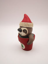 Christmas small sloth in pot wearing Santa hat