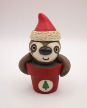 Christmas small sloth in pot wearing Santa hat