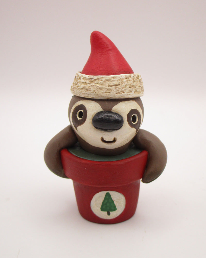 Christmas small sloth in pot wearing Santa hat