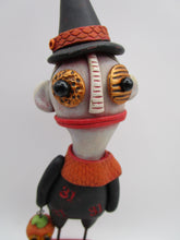 Halloween folk art creepy character with trick or treat bucket