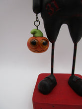 Halloween folk art creepy character with trick or treat bucket