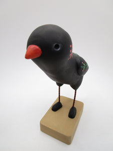 Paper clay folk art style black bird with orange floral and leaf designs misc