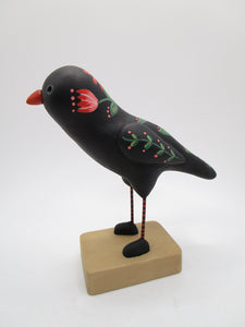 Paper clay folk art style black bird with orange floral and leaf designs misc