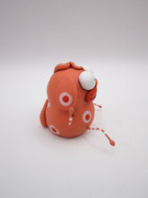 Monster folk art little peach colored monster with bendable arms and legs