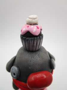 Monster with cupcake on his head
