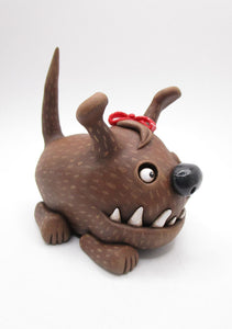 Wacky character cute and frightful big brown dog with spiked teeth