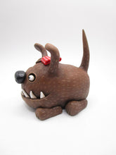 Wacky character cute and frightful big brown dog with spiked teeth