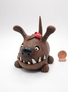 Wacky character cute and frightful big brown dog with spiked teeth