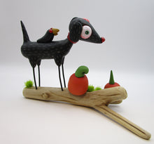 Halloween folk art black dog and crow on driftwood with pumpkins