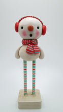 Christmas snowman with ear muffs and matching scarf
