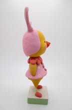 Easter chick wearing a pink bunny hat