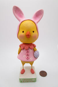 Easter chick wearing a pink bunny hat