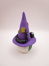 Halloween folk art eyeball wearing witch hat with snake