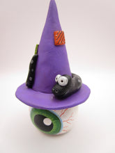 Halloween folk art eyeball wearing witch hat with snake