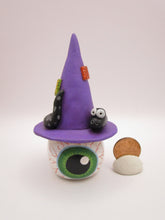Halloween folk art eyeball wearing witch hat with snake