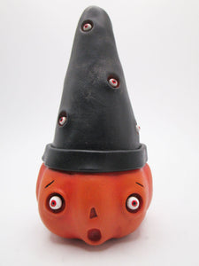 Halloween folk art orange pumpkin man wearing an eyeball black hat