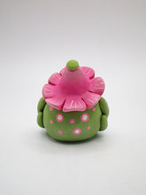 Spring folk art frog wearing pink flower hat