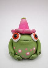 Spring folk art frog wearing pink flower hat