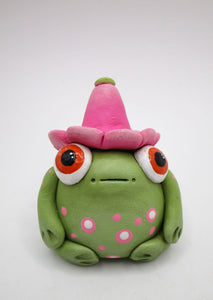 Spring folk art frog wearing pink flower hat