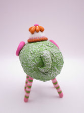 Monster four legged with textured body and flower hat