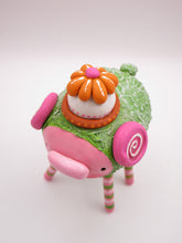 Monster four legged with textured body and flower hat