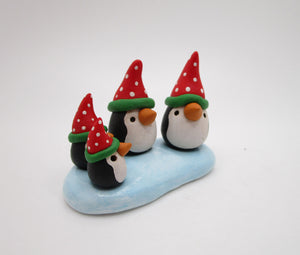 Christmas penguin family on ice