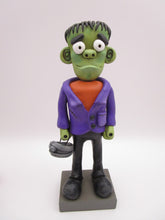 Halloween folk art Frankenstein character with mummy bucket