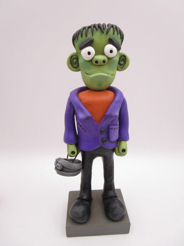 Halloween folk art Frankenstein character with mummy bucket
