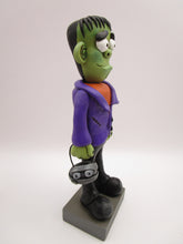 Halloween folk art Frankenstein character with mummy bucket