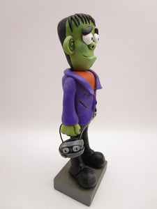 Halloween folk art Frankenstein character with mummy bucket