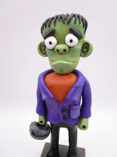 Halloween folk art Frankenstein character with mummy bucket